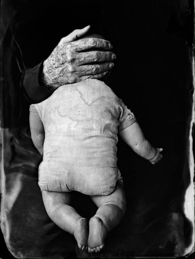 Briechle-2006-doll-with-old-hand-covering-head