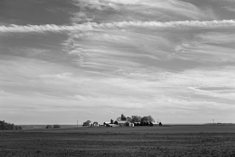 Contrail above farm-small
